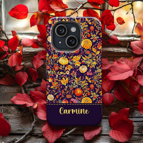 a phone case that has a picture of a pumpkin and flowers on it