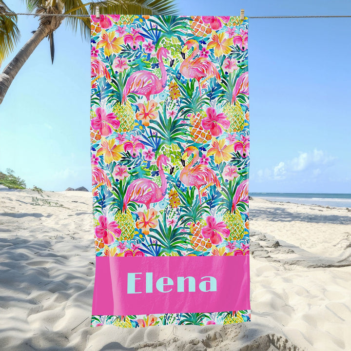 a personalized beach towel on the beach