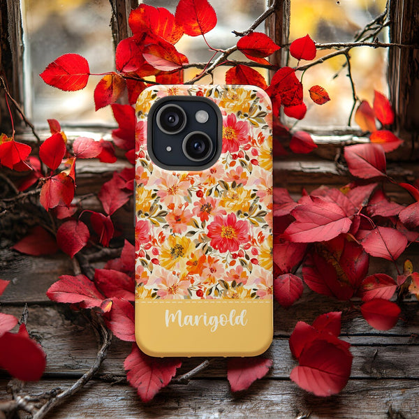 a yellow phone case with a floral pattern on it